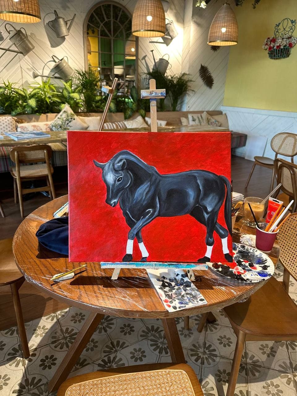 A room view: Bull, Red Ground on a wall, with the ceiling and the floor in frame.